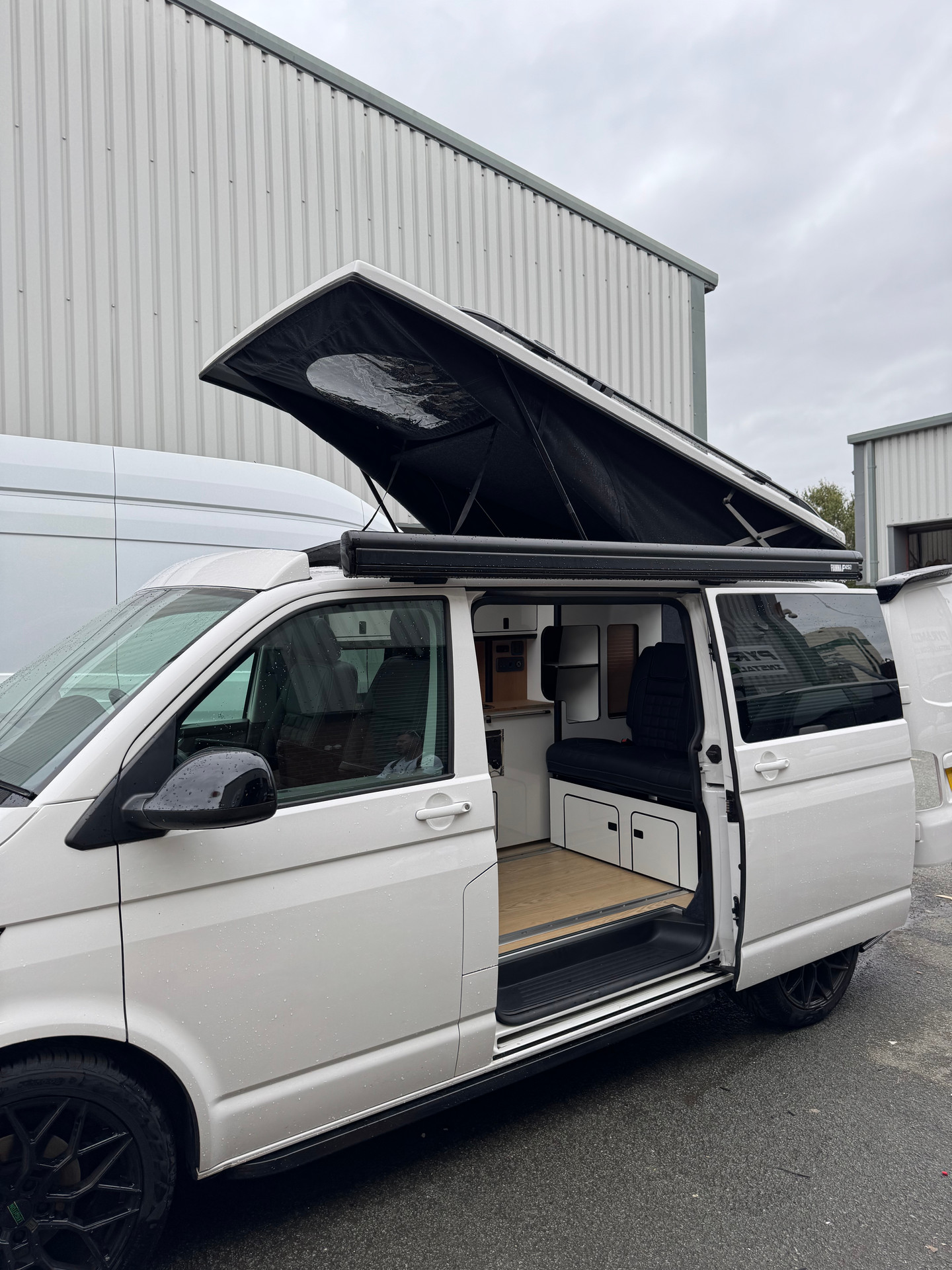 Drivelodge pop top roof raised on a campervan