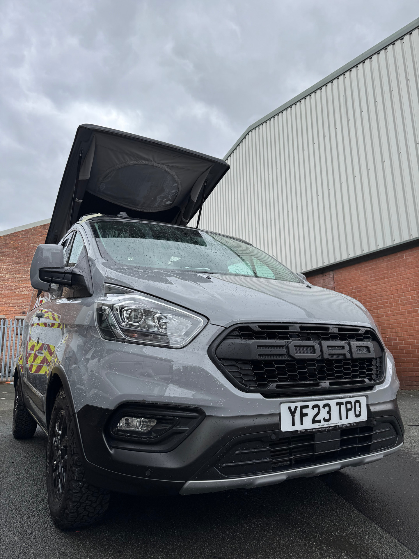 Ford Custom with pop top roof raised