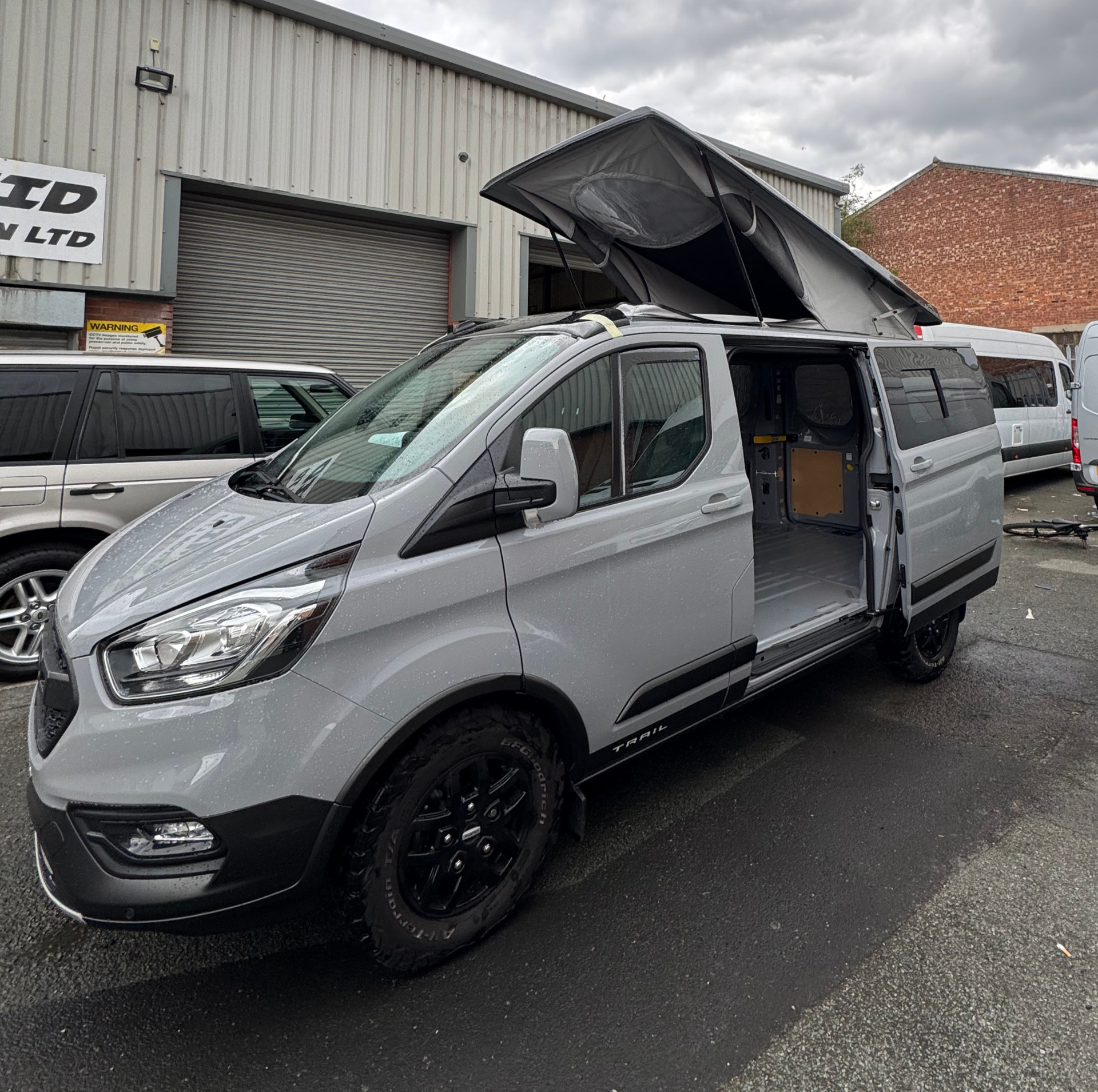 Silver Ford Transit Custom pop top conversion