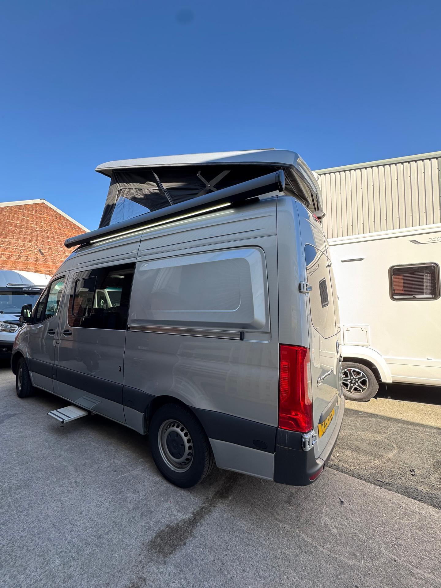 Large van with pop-up roof at our workshop