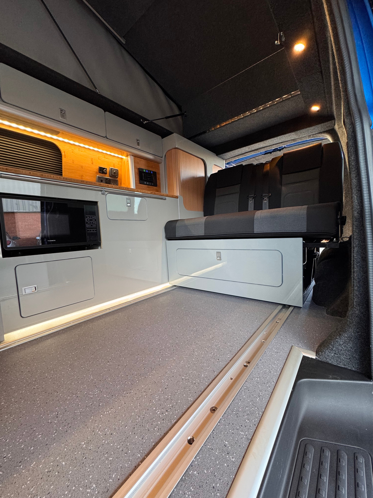 Van with one-piece ply floor