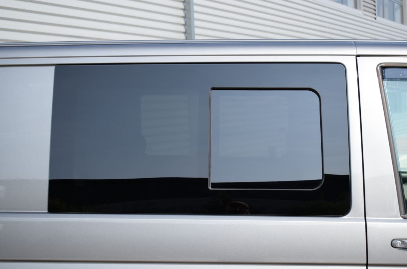 Privacy glass window fitted to a van