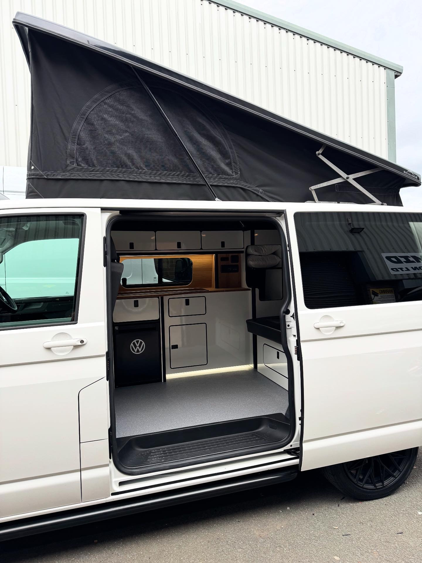 Pop top campervan with side door open